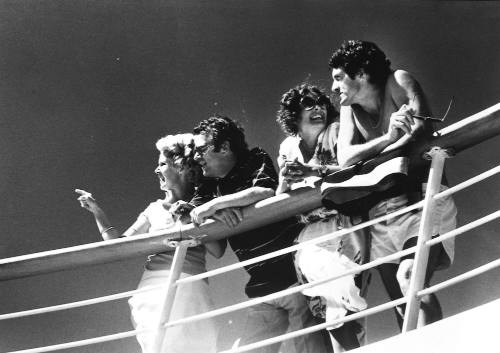 Photograph depicting two copules at a ship's balcony