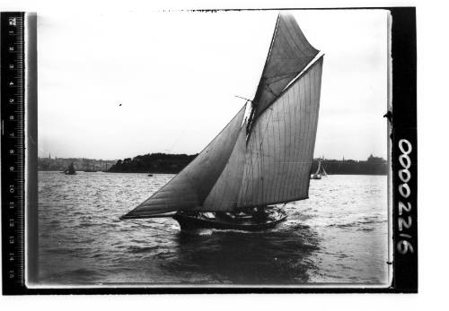 Portside view of a gaff cutter on Sydney Harbour, New South Wales