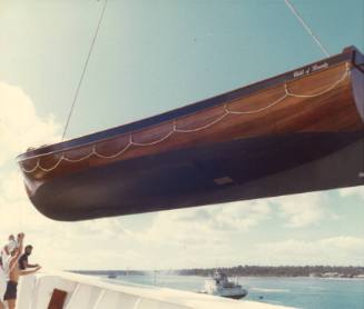 Photograph depicting CHILD OF BOUNTY raft boat being hauled from ORIANA's deck