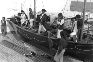 Photograph depicting CHILD OF BOUNTY raft boat on ORIANA's deck