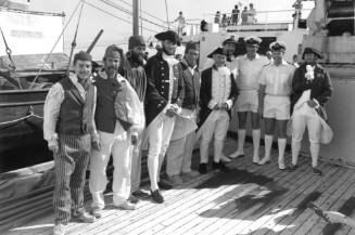 Photograph depicting CHILD OF BOUNTY's crew on ORIANA's deck