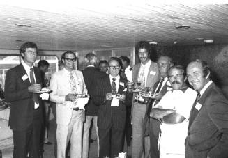 Photograph depicting a group of men posing for the camera