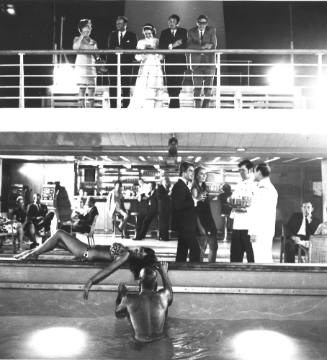 Photograph depicting passengers at a ship's cocktail party