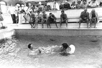 Photograph depicting two women in the pool