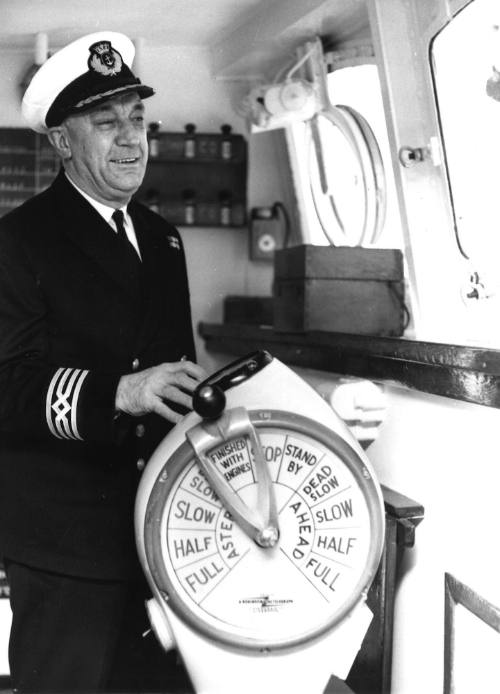 Captain John Plant on the bridge of SS CATHAY