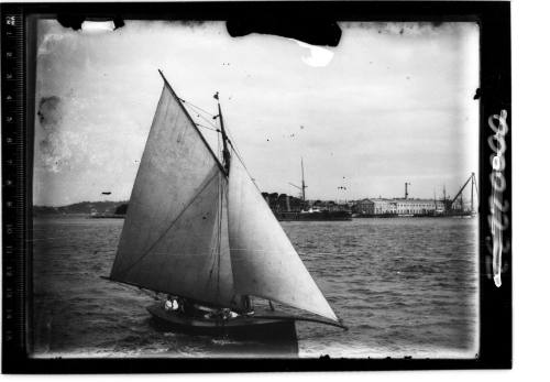 Starboard view of gaff sloop off Garden Island, Sydney Harbour