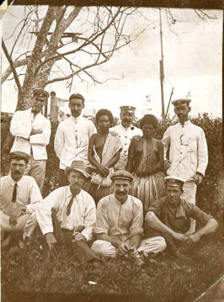 Ship's engineer Martin MacGilivray, back left, with a group of men and two Islander women