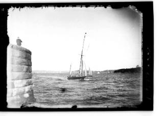 Starboard view of a yacht, possibly MIRANDA, near Fort Denison, Sydney Harbour