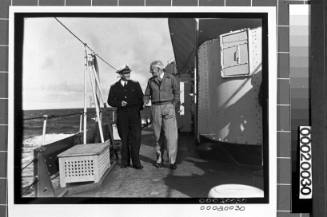 Civilian conversing with a merchant marine officer
