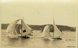 Postcard featuring a photograph of three skiffs