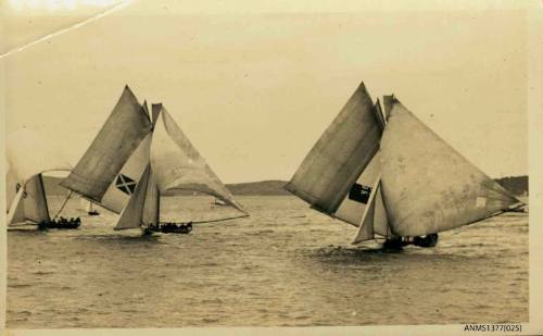 Postcard featuring a photograph of three skiffs sailing