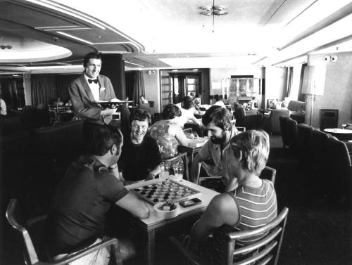 Photograph depicting a group of people playing checkers