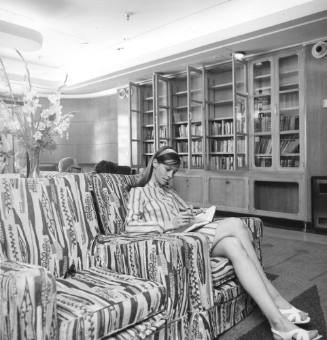 Photograph depicting a woman reading