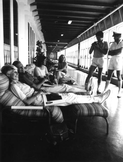 Photograph depicting a group of people at a ship's veranda