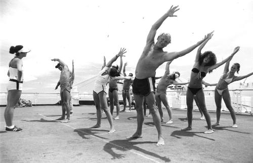 Photograph depicting a group of passengers excercising on deck