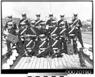 Group portrait of the Royal Marines Band of HMS DORSETSHIRE