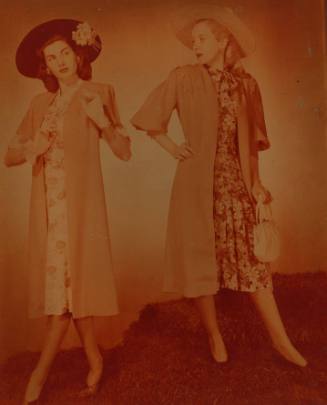 Photograph depicting two women in summer dresses and hats