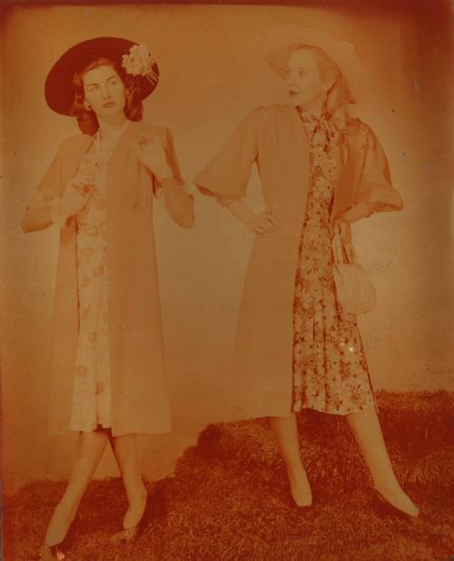 Photograph depicting two women in summer dresses and hats