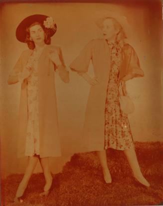 Photograph depicting two women in summer dresses and hats