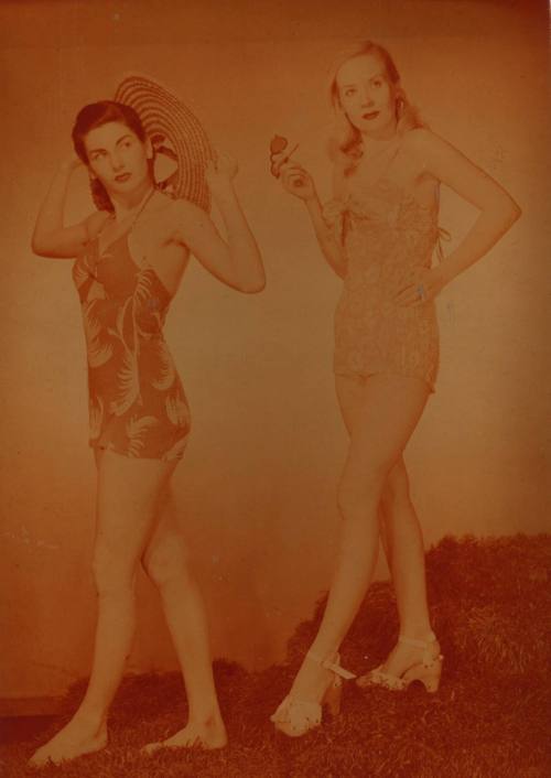 Photograph depicting two women in swimming suits