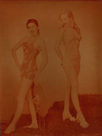 Photograph depicting two women in swimming suits