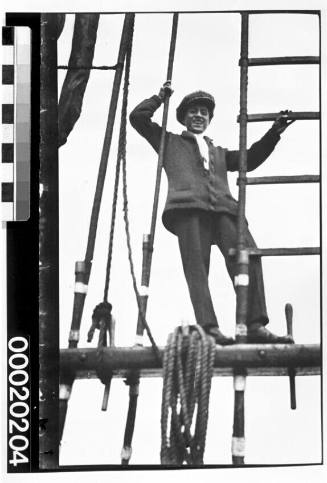 Unidentified boy on ships rigging