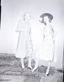 Negative depicting two women in summer dresses
