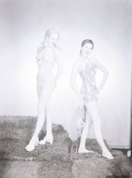 Negative depicting two women in swimming suits