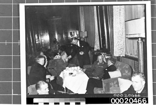 Military personnel seated in a lounge or saloon