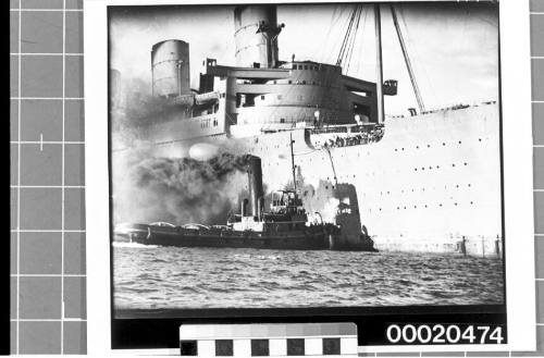 RMS QUEEN MARY and what is most likely the tug SS HEROIC in Sydney Harbour