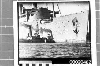 RMS QUEEN MARY and a tug, most likely SS HEROIC, in Sydney Harbour