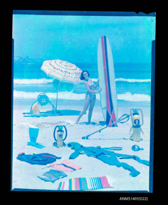 Transparency depicting a woman with a surf board