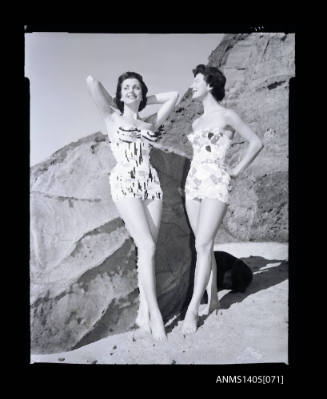 Negative depicting two women modelling swimwear