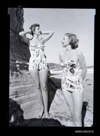 Negative depicting two women modelling swimwear