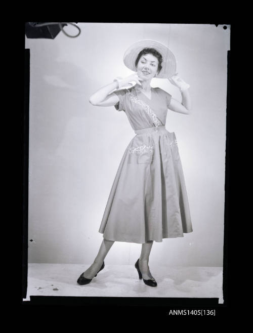 Negative depicting a woman  modelling a summer dress