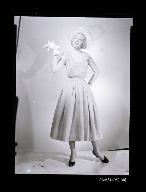 Negative depicting a woman  modelling a summer dress