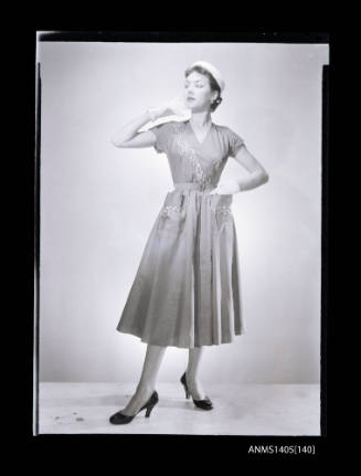 Negative depicting a woman  modelling a summer dress