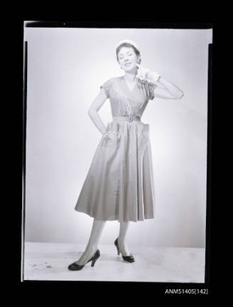 Negative depicting a woman  modelling a summer dress