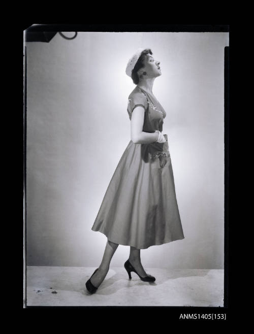 Negative depicting a woman  modelling a summer dress