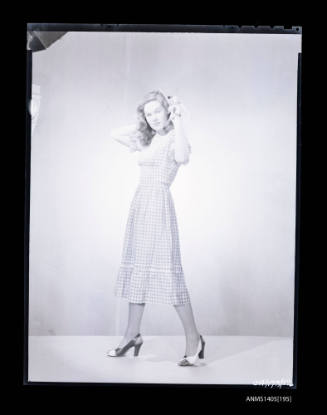 Negative depicting a woman modelling a summer dress