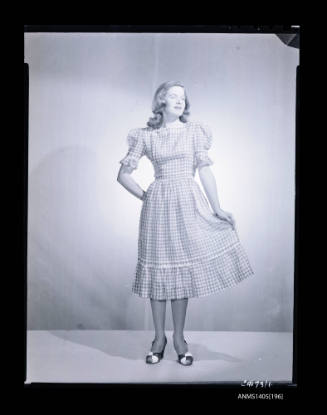 Negative depicting a woman modelling a summer dress