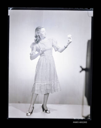 Negative depicting a woman modelling a summer dress