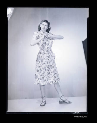 Negative depicting a woman modelling a summer dress