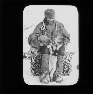 Horace Edgar Buckridge with puppies

