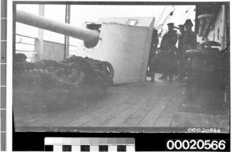 Four naval officers standing on deck