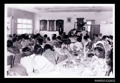 People gathered in room for a performance