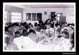 People gathered in room for a performance