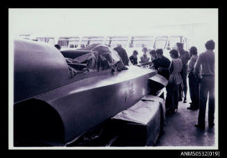 View in hangar of speed boat SPIRIT OF AUSTRALIA cockpit covered with material