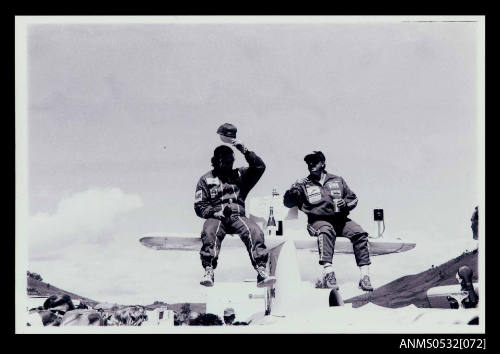 Ken Warby and Robert Apathy on the tail plane of SPIRIT OF AUSTRALIA