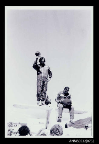 Ken Warby and Robert Apathy on the tail plane of SPIRIT OF AUSTRALIA